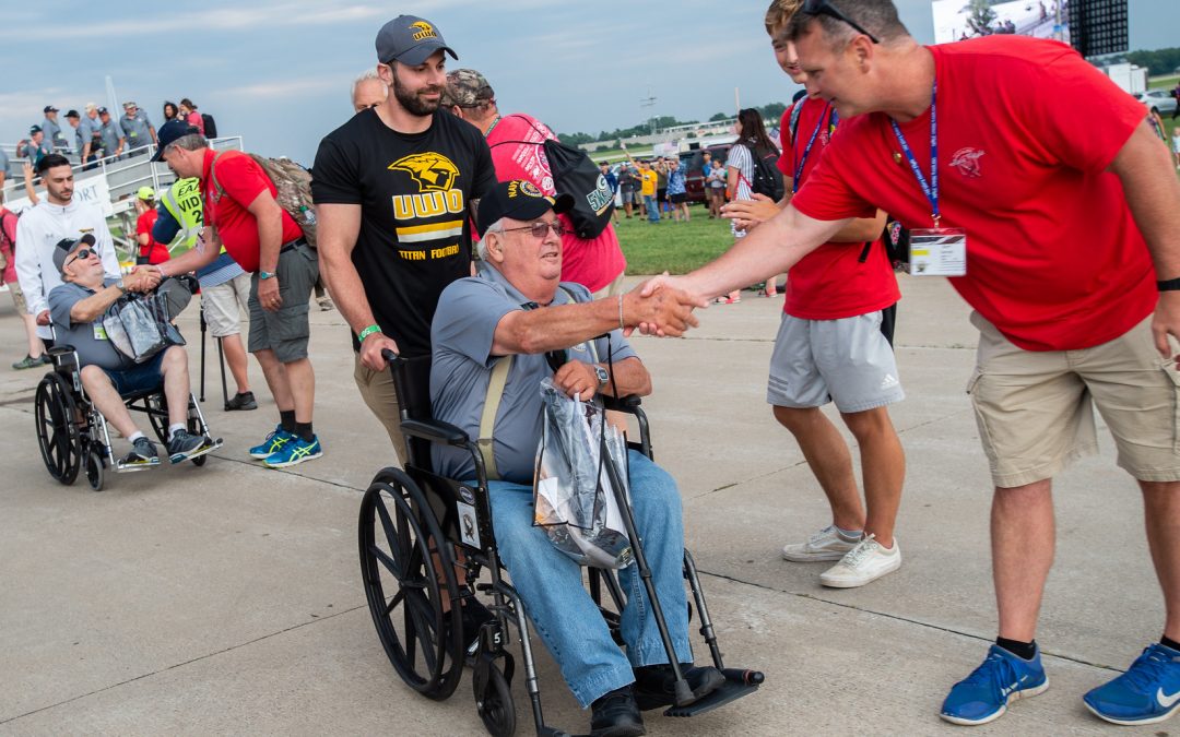 UW Oshkosh football players assist, celebrate Honor Flight veterans