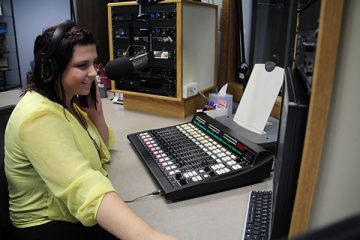 Student station manager Allyssa Lile checking out the new console in the WRST on air studio.   